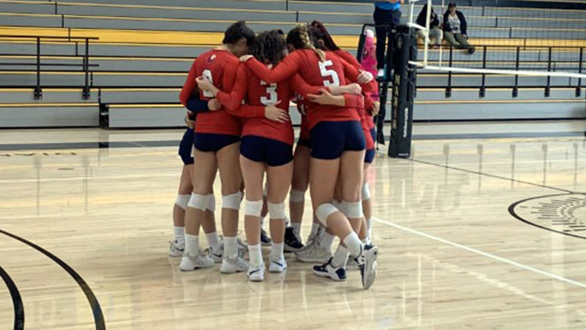 The Rams huddle before the game.